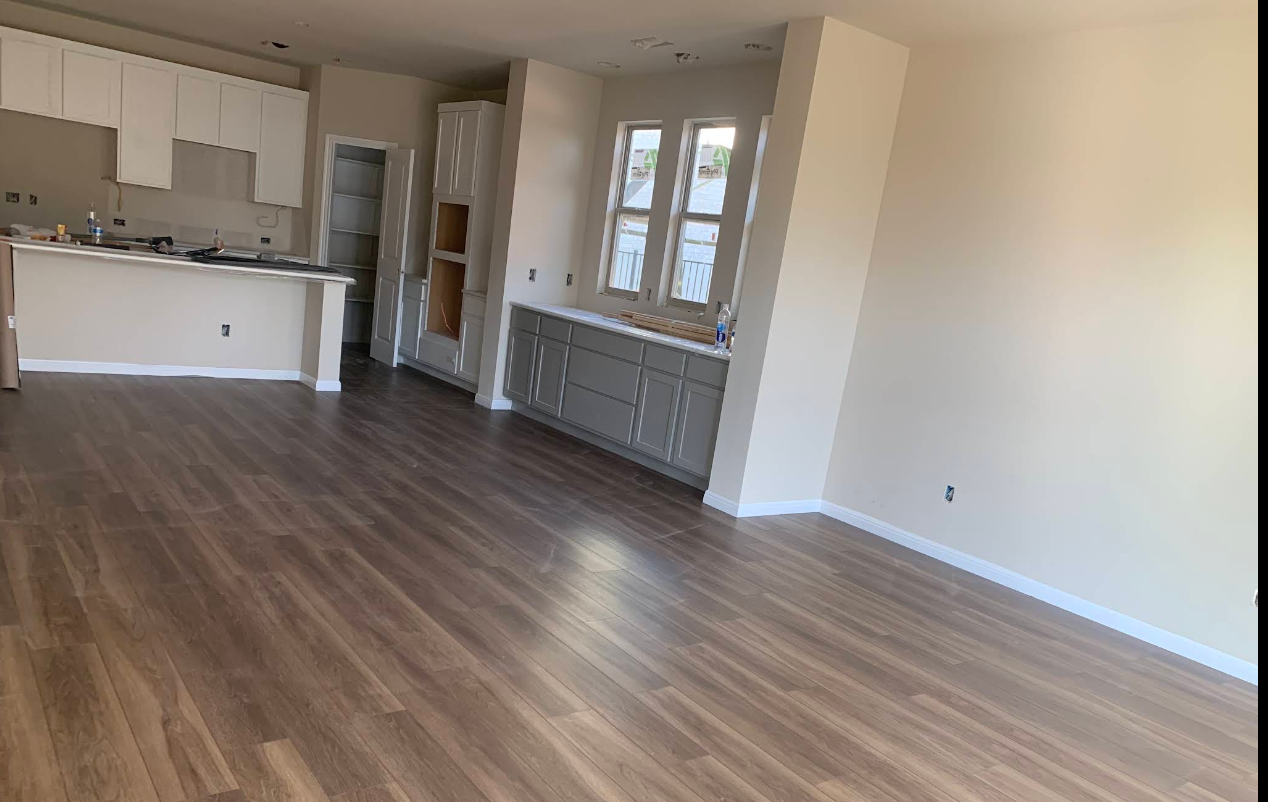 Open Living Room and Dining Room Wood Plank Flooring